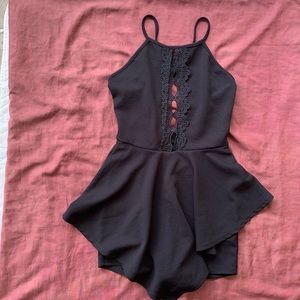 Black FASHION NOVA dress/romper. Size Medium.